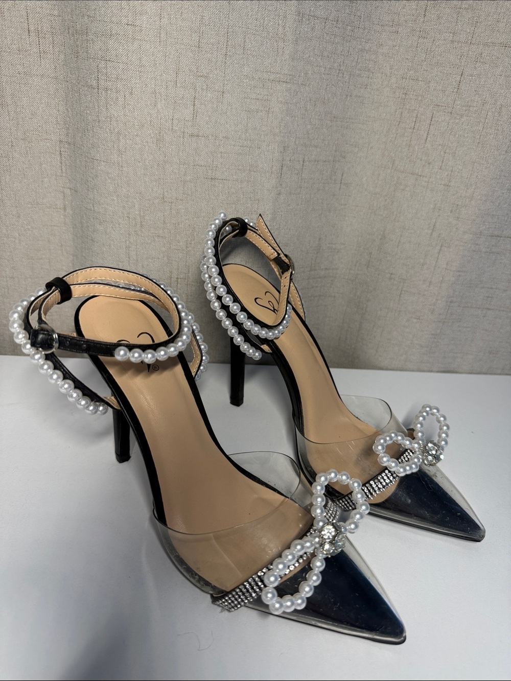 Windsor Black Pointed Clear Heels with Pearl Bow Accents